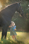 girl and Friesian Horse