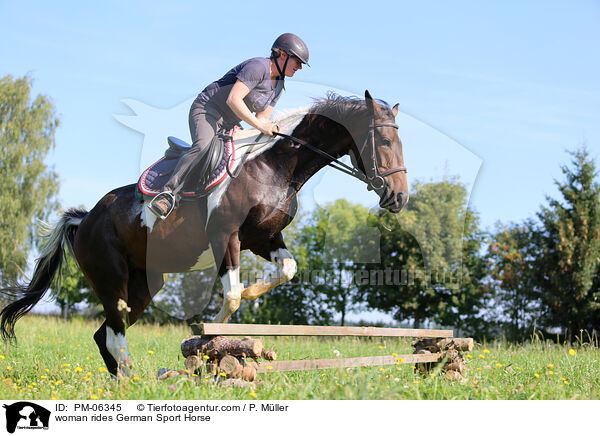 woman rides German Sport Horse / PM-06345