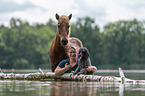woman with Islandic horse and poodle