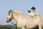 man with horse and pug