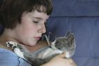 woman and Devon Rex