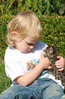 child with kitten