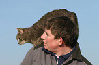 man with domestic cat