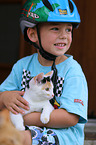 boy and young cat
