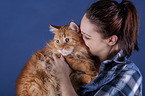 woman and Maine Coon