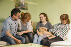 family with Siberian Cat
