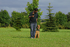 man and Airedale Terrier
