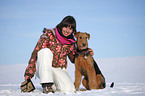 young woman with Airedale Terrier