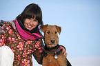 young woman with Airedale Terrier