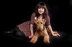 young woman with Airedale Terrier