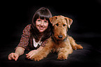 young woman with Airedale Terrier