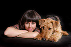 young woman with Airedale Terrier