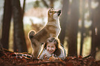 girl with Akita Inu puppy