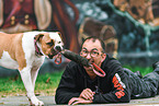 man and American Bulldog