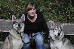 woman and american wolfdogs