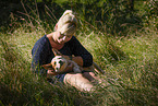 young woman with Australian Cattle Dog puppy