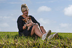 young woman with Australian Cattle Dog puppy