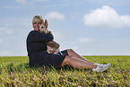 young woman with Australian Cattle Dog puppy