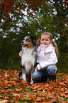 girl and Australian Shepherd