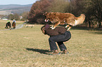 woman and Australian Shepherd