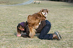 woman and Australian Shepherd