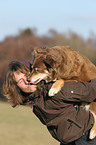 woman and Australian Shepherd