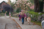 girls with Australian Shepherds