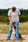 woman and Australian Shepherd