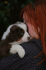 woman with Australian Shepherd Puppy
