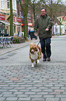 man and Australian Shepherd