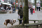 man and Australian Shepherd