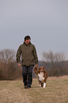man and Australian Shepherd