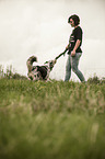 woman and Australian Shepherd