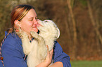 woman and Australian Shepherd Puppy