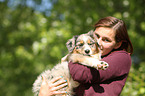 woman and Australian Shepherd Puppy