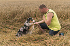 man and Australian Shepherd