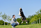 man with Australian Shepherd