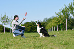 man with Australian Shepherd