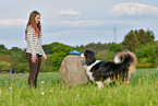 woman with Australian Shepherd