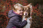 girl and Australian Shepherd