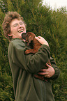 woman with Bavarian Mountain Hound puppy