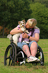 woman and Biewer Yorkshire Terrier