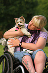 woman and Biewer Yorkshire Terrier