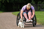 woman and Biewer Yorkshire Terrier