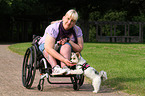 woman and Biewer Yorkshire Terrier