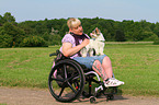 woman and Biewer Yorkshire Terrier