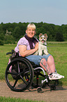 woman and Biewer Yorkshire Terrier