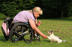 woman and Biewer Yorkshire Terrier