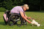 woman and Biewer Yorkshire Terrier