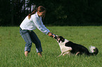 woman plays with dog